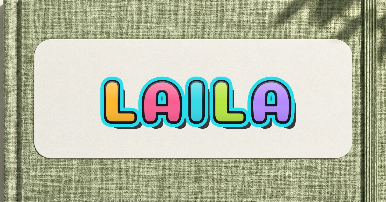 LAILA in rounded colorful graffiti lettering on a blank notebook name sticker
